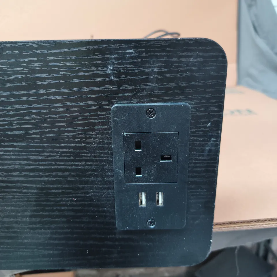 BLACK DESK FRAME WITH TOP PANEL AND INTEGRATED POWER OUTLET