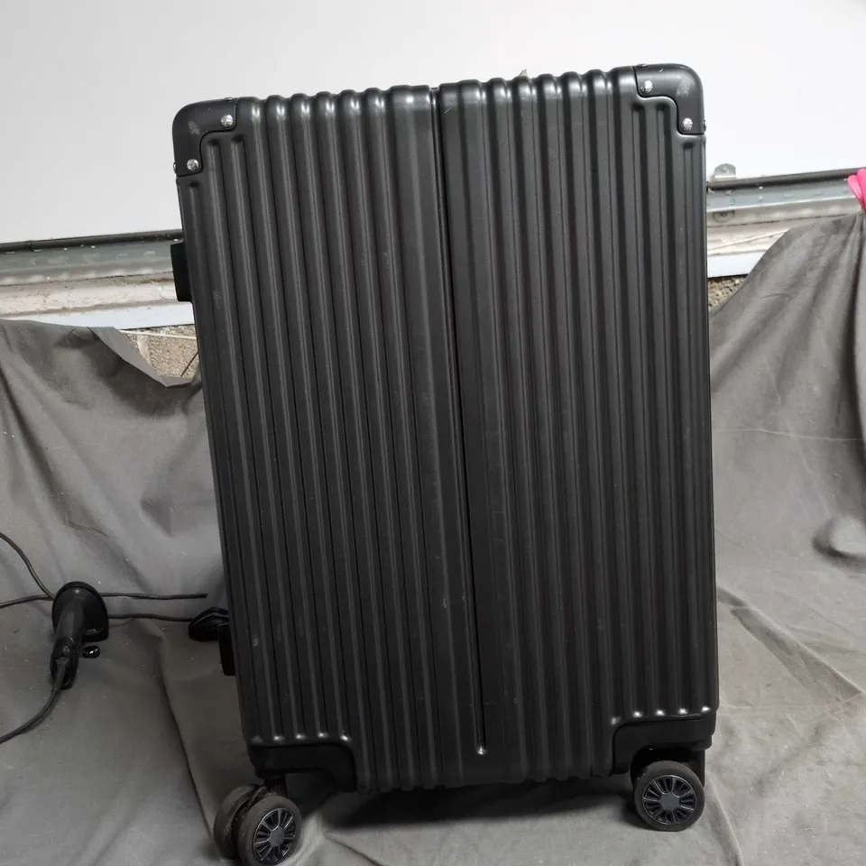 BLACK HARD-SHELL SUITCASE WITH FOUR WHEELS