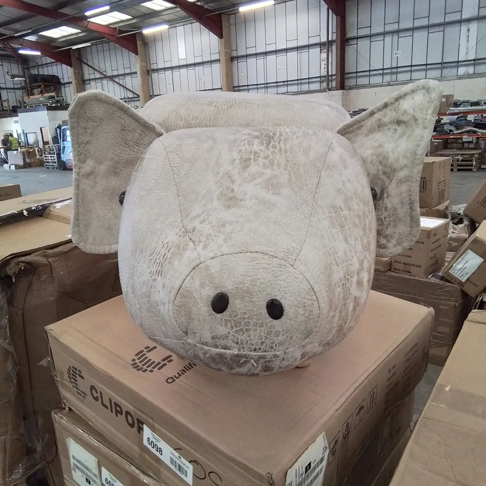 A FAUX LEATHER UPHOLSTERED ANIMAL THEMED OTTAMAN/POUFFE 