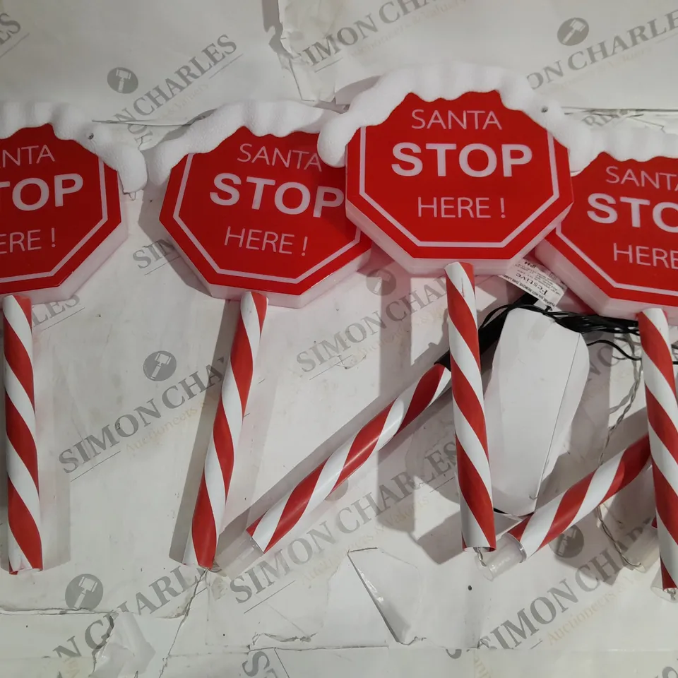 FESTIVE SET OF PRELIT SANTA STOP HERE STAKES