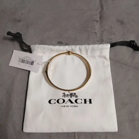 COACH NEW YORK GOLD-TONE BRACELET β BANGLE WITH POUCH