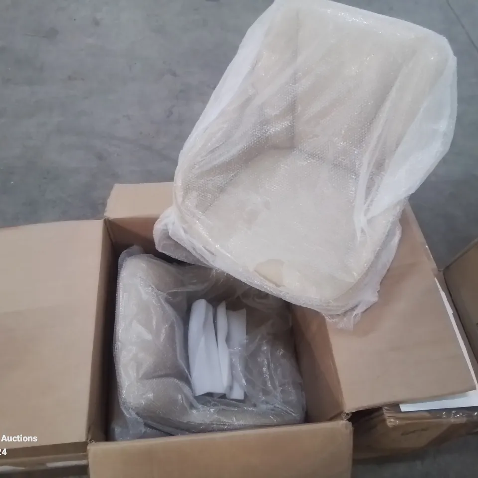A BOXED PAIR OF CREAM FAUX LEATHER UPHOLSTERED DINING/SIDE CHAIRS