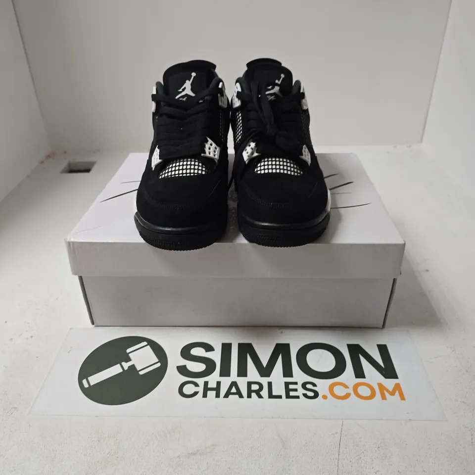 BOXED PAIR OF NIKE AIR JORDAN 4 RETRO TRAINERS IN BLACK - UK 7.5