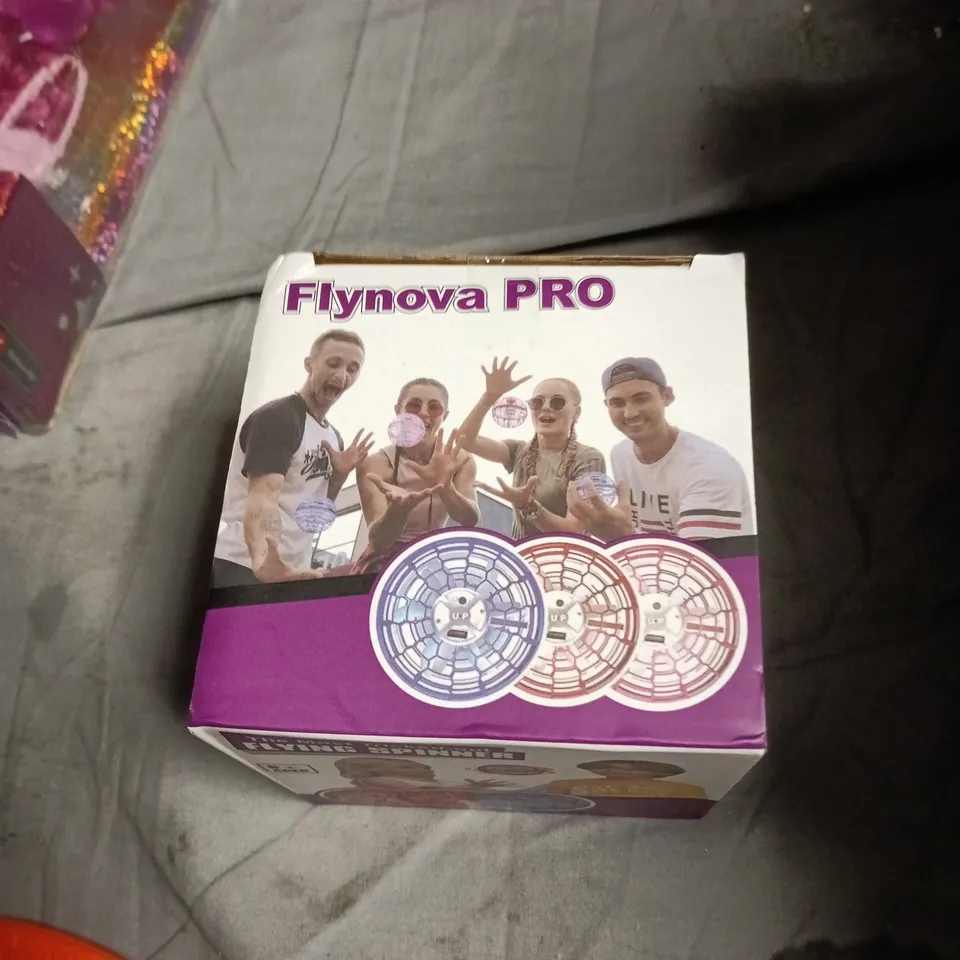 APPROXIMATELY 10 ASSORTED TOYS INCLUDING RAINBOW HIGH DOLL , FLYNOVA PRO AND THE DONKEY SANCTUARY TOP TRUMPS 