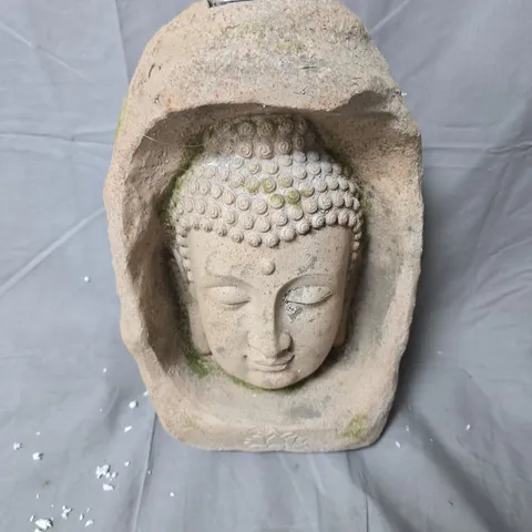 BUDDHA HEAD STONE GARDEN ORNAMENT IN ROCK SURROUND