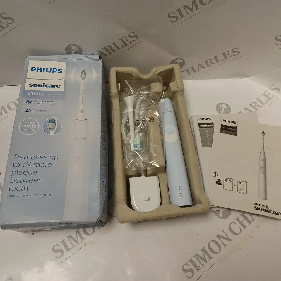 BOXED PHILIPS SONIC TOOTHBRUSH -  SONICARE MODEL 4300 - WITH CHARGING BASE AND USER MANUAL