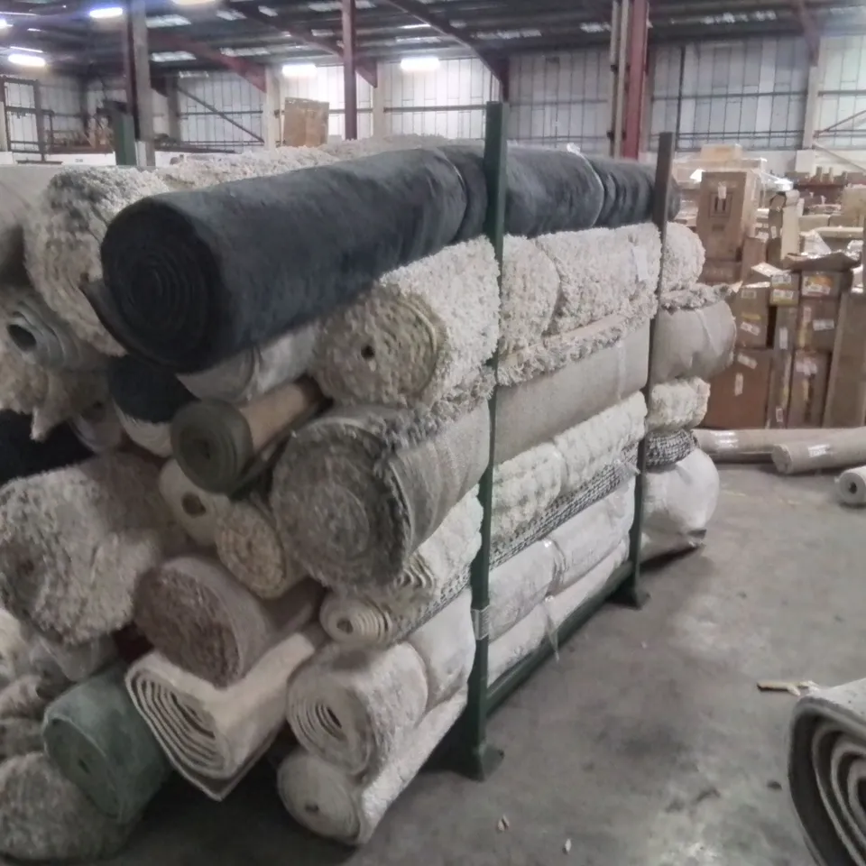 STILLAGE OF APPROXIMATELY 30 QUALITY DESIGNER RUGS