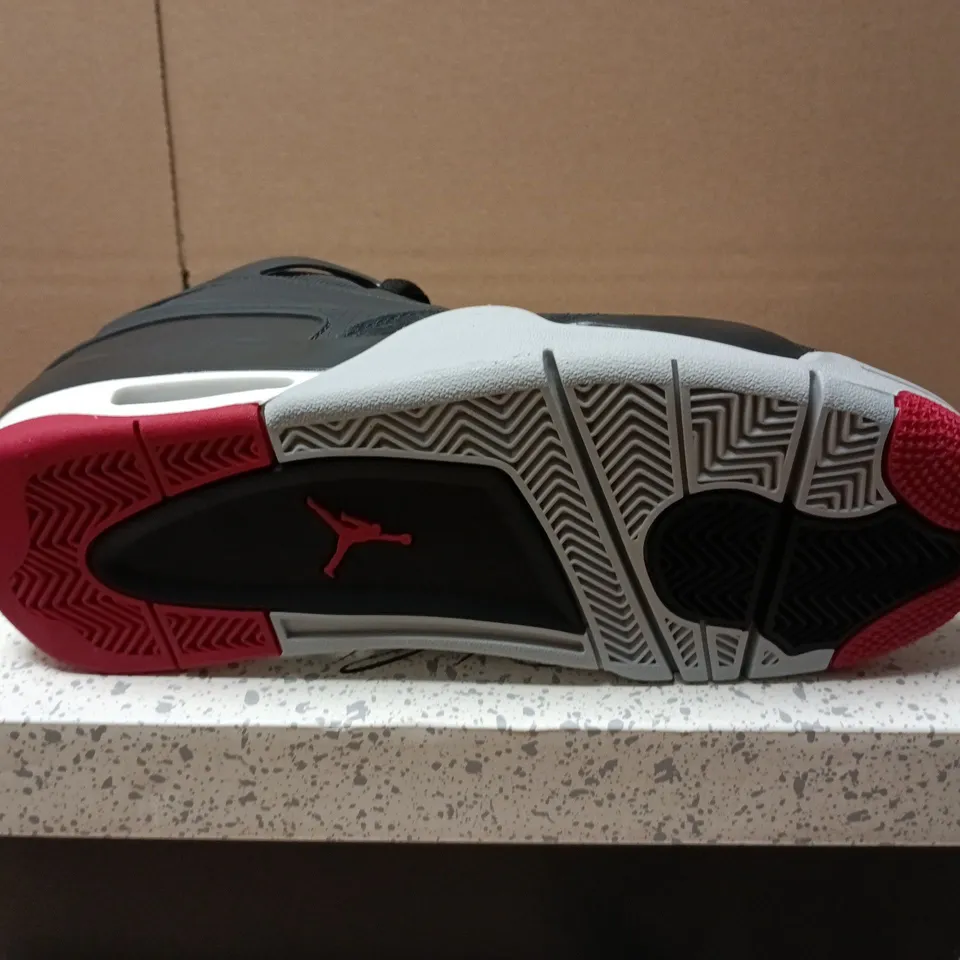 BOXED PAIR OF NIKE AIR JORDAN 4 RM TRAINERS IN BLACK - UK 7
