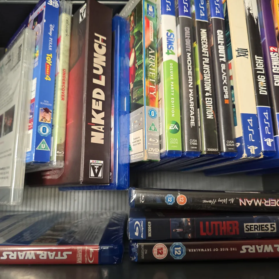 TOTE OF APPROXIMATELY 12 ASSORTED DVD'S & GAMES TO INCLUDE - PS4 JAMANJI THE VIDEO GAME , PS4 CALL OF DUTY BLACK OPS IIII , BLUE RAY THE UNIVERSAL THEORY ETC