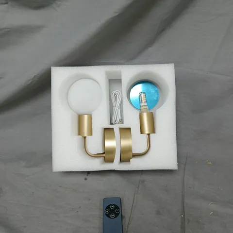 GOLD FINISH DUAL-ARM LED WALL LIGHT WITH REMOTE CONTROL. ITEM MISSING ONE GLASS LAMP