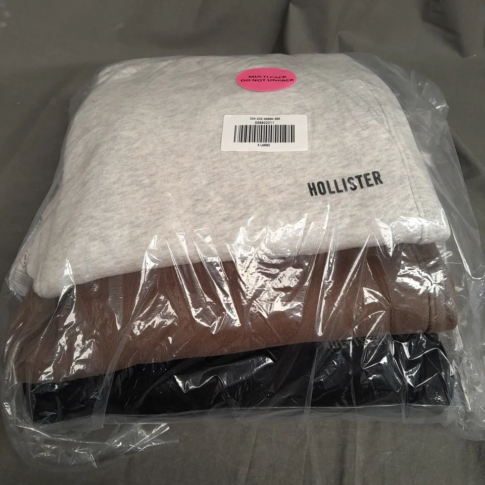 SEALED HOLLISTER SET OF 3 JOGGERS IN VARIOUS COLOURS TO INCLUDE - GREY , BROWN , BLACK - XL