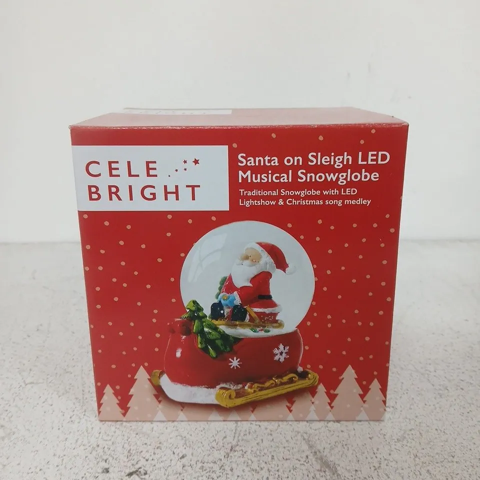 CELEBRIGHT SANTA ON SLEIGH LED MUSICAL SNOWGLOBE