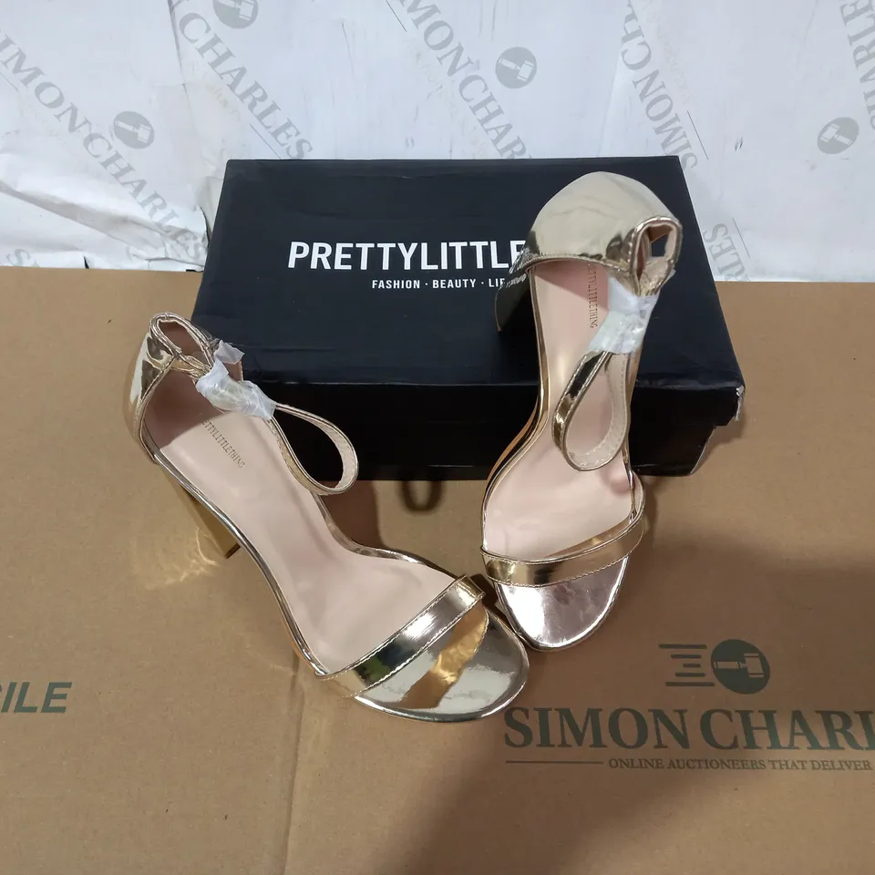 BOXED PAIR OF PRETTY LITTLE THING GOLD HIGH HEELS SIZE 6