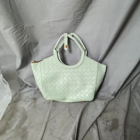 Mint green woven leather handbag with circular top handles 
