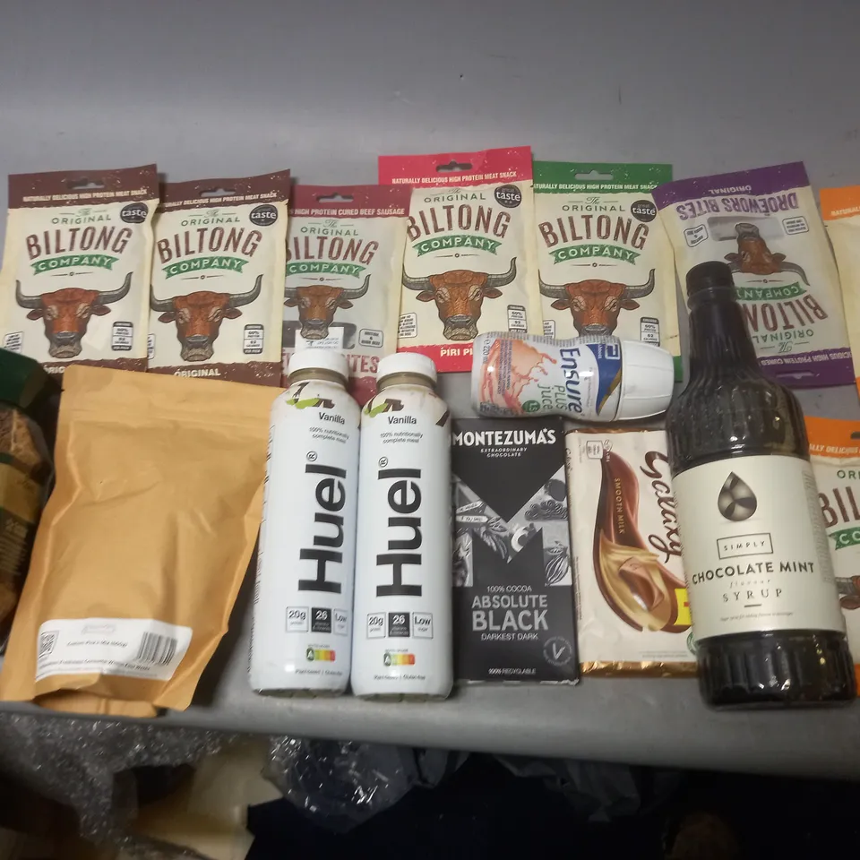 TOTE OF APPROX 10 ASSORTED FOOD ITEMS TO INCLUDE - HUEL VANILLA , BILTONG BEEF, AND JACOBS COFFEE ETC. 