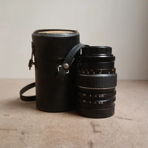 VINTAGE CAMERA LENS WITH BLACK LEATHER CASE