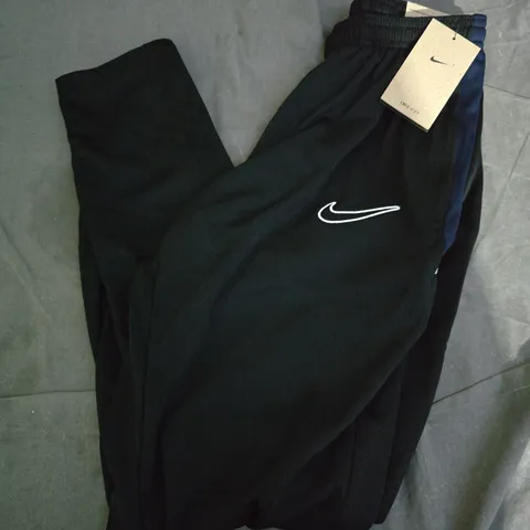 NIKE ACADEMY TRACKSUIT BOTTOMS IN BLACK - MEDIUM