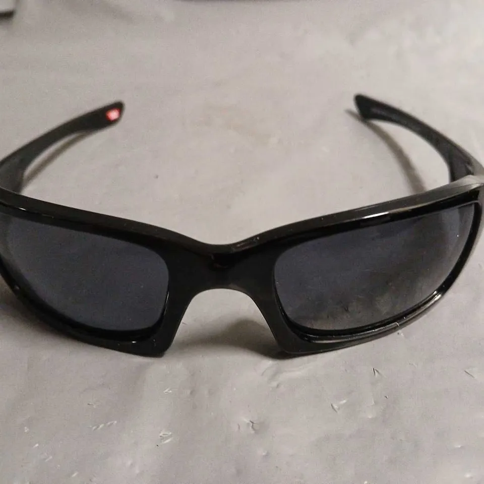 PAIR OF OAKLEY BLACK FRAMED GLASSES