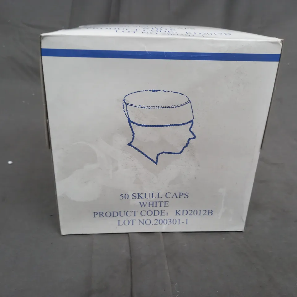 A BOX OF APPROXIMMATELY 50 WHITE, UNBRANDED SKULL CAPS 
