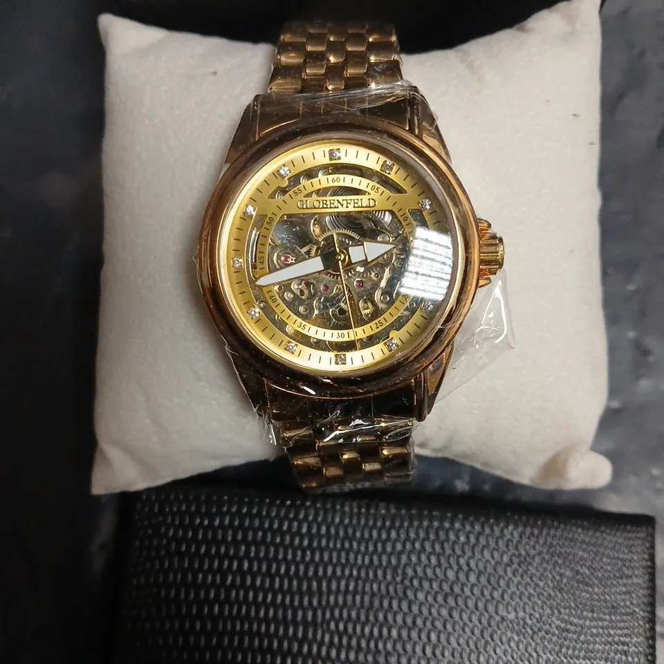 GLOBENFELD SKELETON DIAL GOLD-TONE WATCH