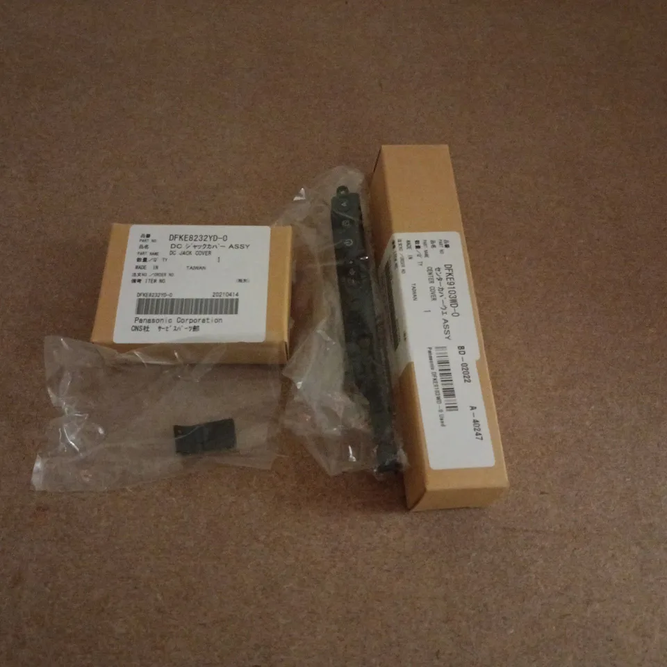 APPROXIMATELY 30 ASSORTED PANASONIC ACCESSORIES TO INCLUDE CENTER COVERS & DC JACK COVERS