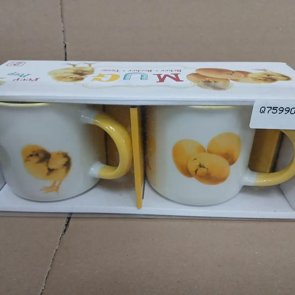 TWO CERAMIC MUGS WITH CHICK DESIGN