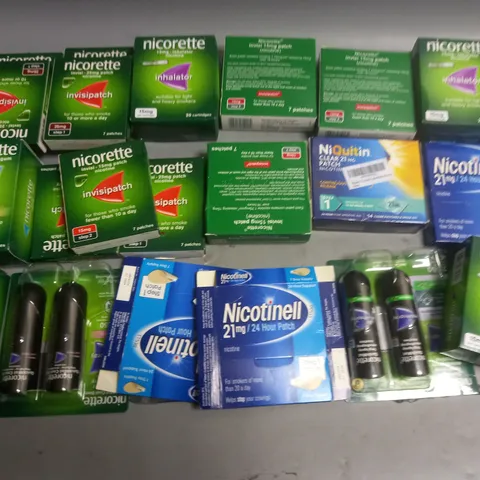 LOT OF APPROXIMATELY 35 ASSORTED QUIT SMOKING AIDS TO INCLUDE NICORETTE AND NICOTINELL