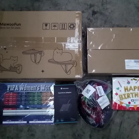 PALLET OF 5 BOXES CONTAINING ASSORTED ITEMS INCLUDING CAT FURNITURE, HAPPY BIRTHDAY BALLOONS, HALLOWEEN MASK, FIFA WOMEN WORLD CUP POSTER, HARD DRIVE ADAPERTER, SHOWER CADDY