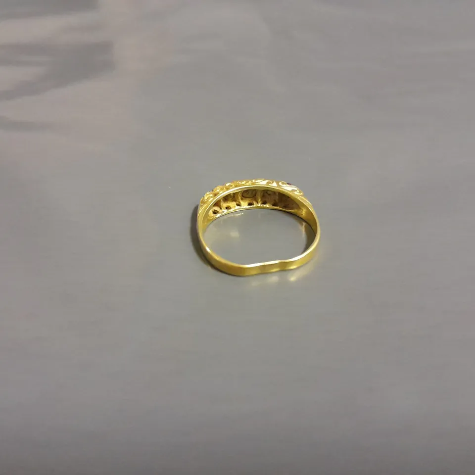 GOLD RING WITH 5 SET STONES 