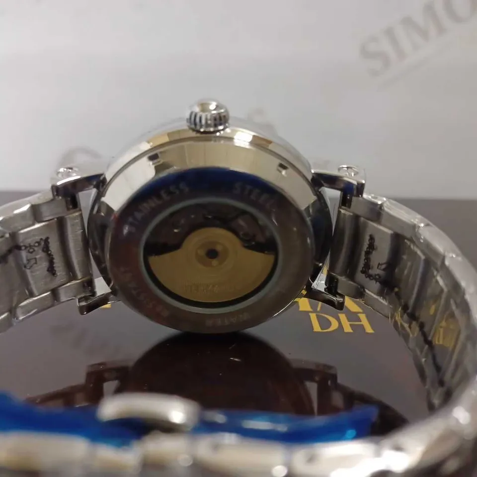 MEN’S HELMA DH AUTOMATIC WORLD VIEW WATCH – TOURBILLON MOVEMENT – BLUE DIAL – STAINLESS STEEL STRAP – GLASS EXHIBITION BACK CASE – LEATHER STRAP INCLUDED 