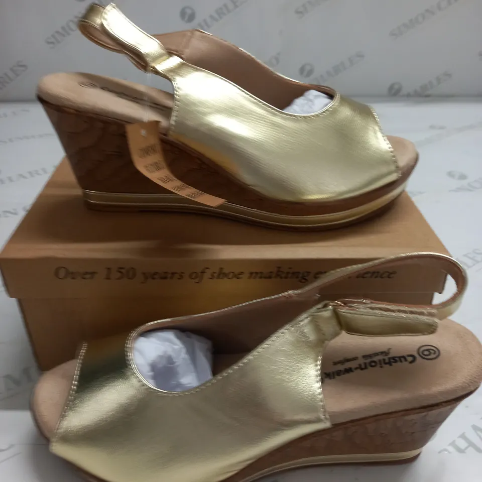 BOXED PAIR OF CUSHION WALK WEDGE SHOES IN GOLD - SIZE 6