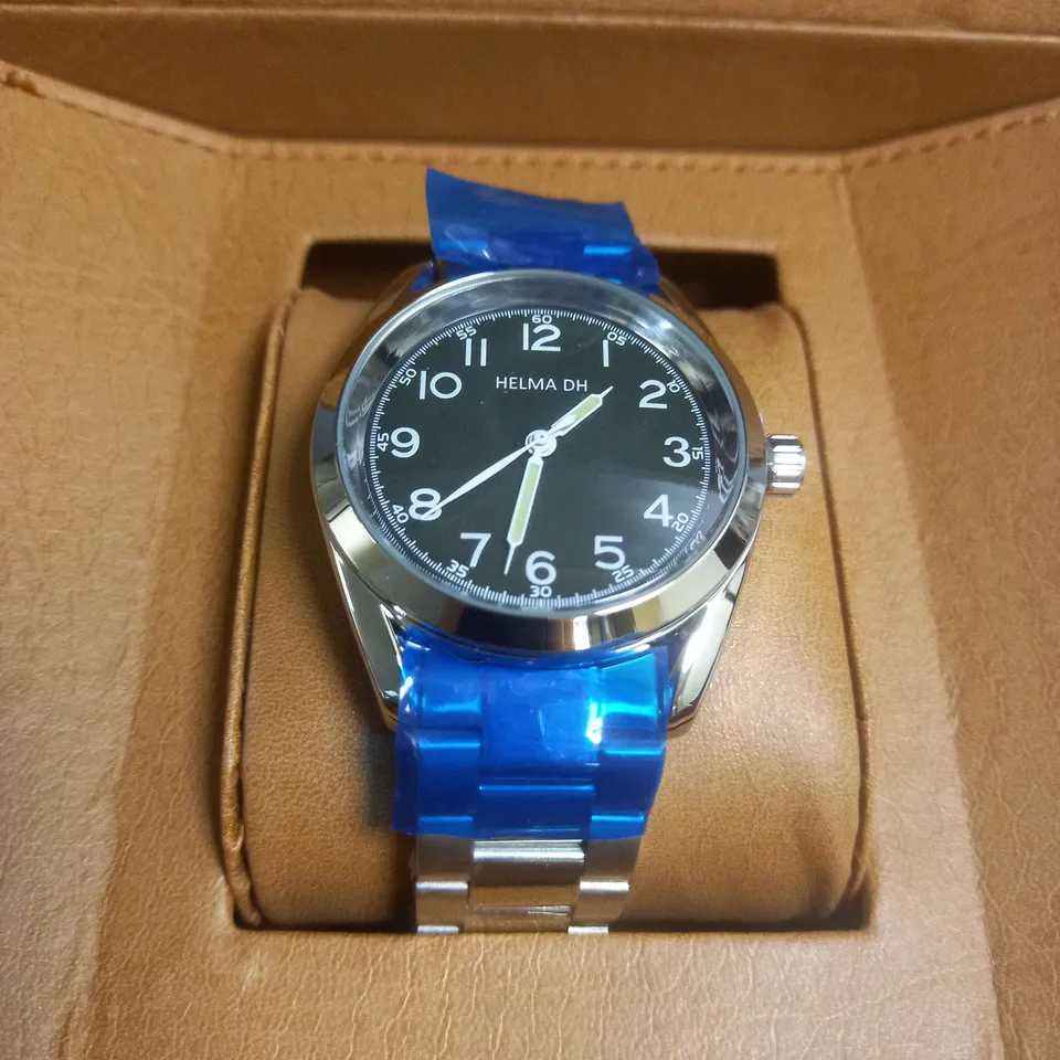 BOXED HELMA DH WATCH WITH GREEN FACE IN SILVER