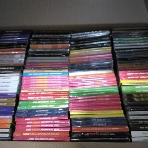 APPROXIMATELY 100 ASSORTED CDS AND DVDS TO INCLUDE NOW MUSIC 18, NOW YEARBOOK, AND NOW THAT'S WHAT I CALL ETC.