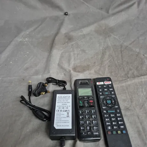 TOTE OF APPROXIMATELY 15 ELECTRICAL PRODUCTS TO INCLUDE HOME PHONE HANDSET, TV REMOTE AND POWER ADAPTERS