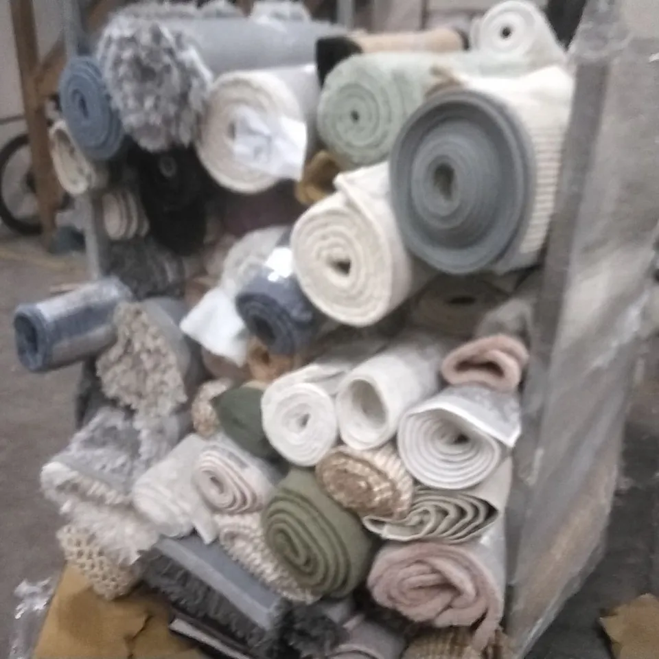 STILLAGE OF APPROXIMATELY 40 ESIGNER RUGS