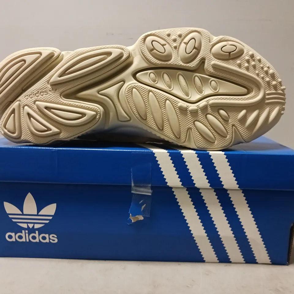 BOXED PAIR OF ADIDAS OZWEEGO SHOES IN BEIGE UK SIZE 9