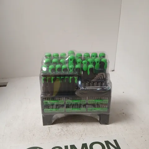 MULTI-TOOL SET WITH GREEN-HANDLED IMPLEMENTS IN A BLACK PLASTIC CASE