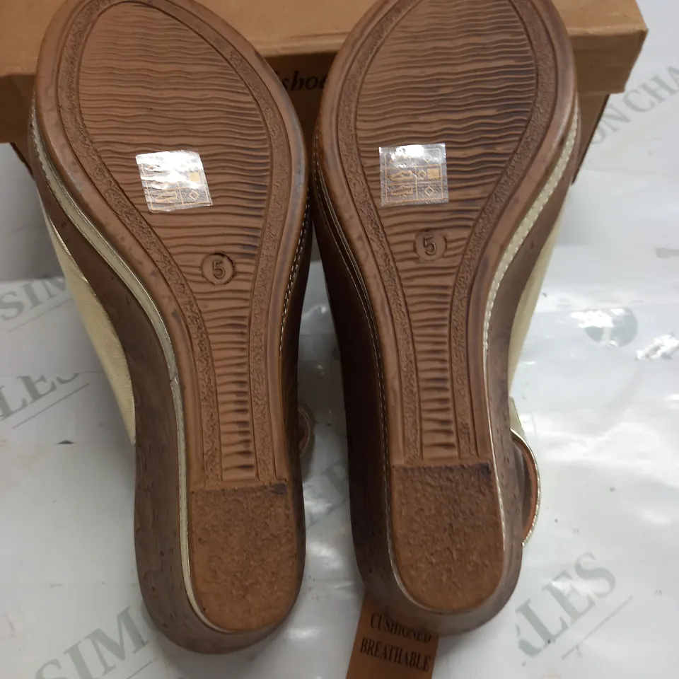 BOXED PAIR OF CUSHION WALK GOLD WEDGE HEEL SHOES IN GOLD - SIZE 5