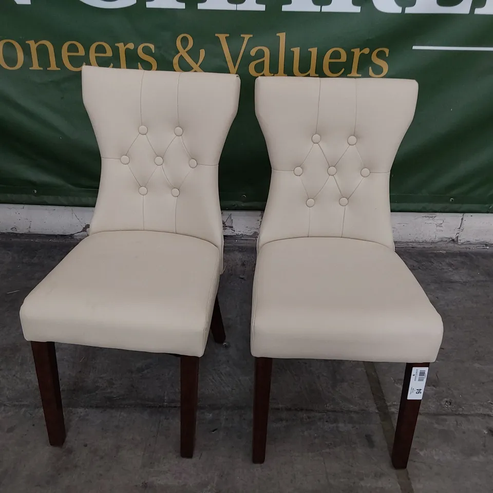 PAIR OF UPHOLSTERED BUTTONED BACK DINING CHAIRS CREAM PU ON DARK WOOD LEGS 