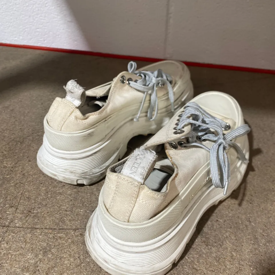 PAIR OF ALEXANDER MCQUEEN CREAM TRAINERS 