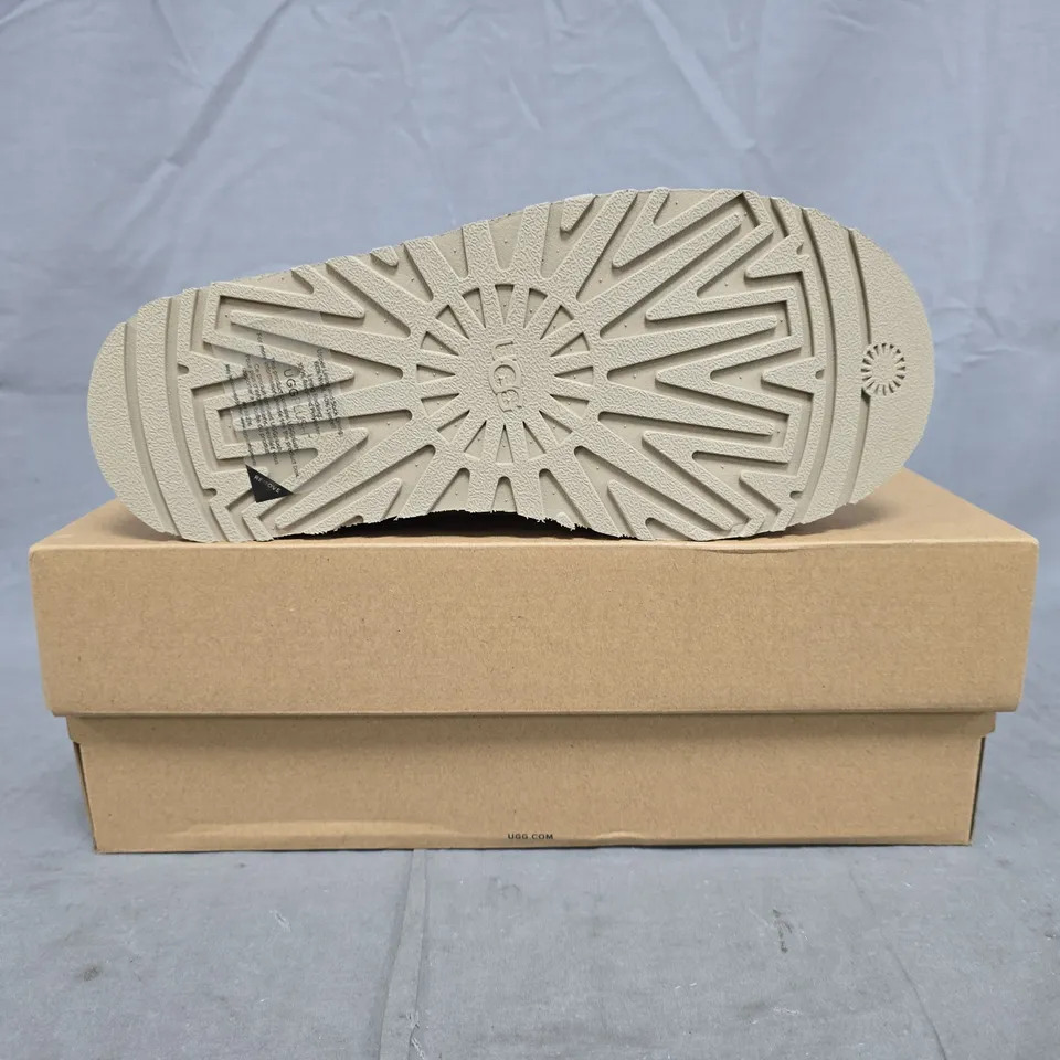 BOXED PAIR OF UGG K TAZZ SHOES IN SAND SIZE UK 4