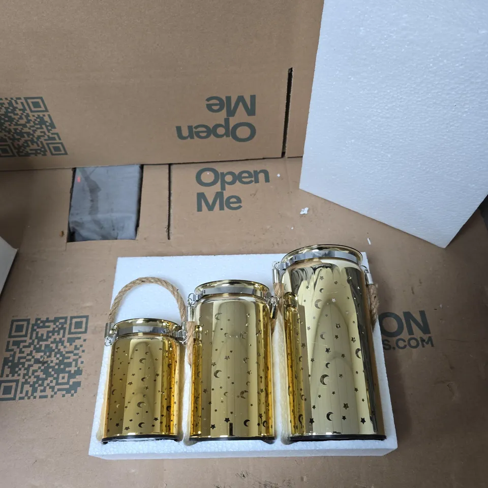 BOX OF 4 SETS OF 3 GOLD LANTERNS WITH STAR AND CRESCENT CUT-OUTS AND ROPE HANDLES AND LIGHTS INSIDE