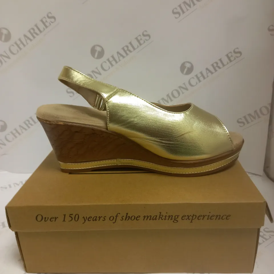 BOXED PAIR OF CUSHION WALK GOLD STRAPPY WEDGE HEELED SHOES - SIZE 7