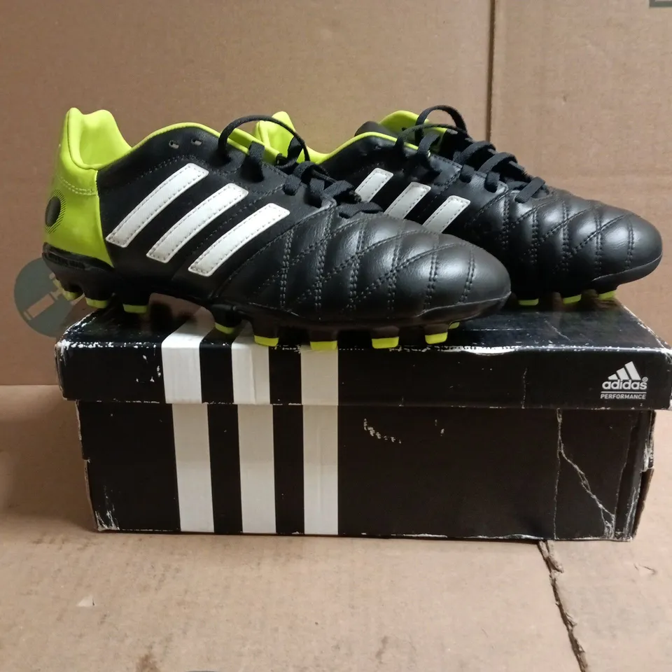 BOXED PAIR OF ADIDAS 11NOVA TRX AG J FOOTBALL BOOTS IN BLACK/LIME SIZE UK 5.5
