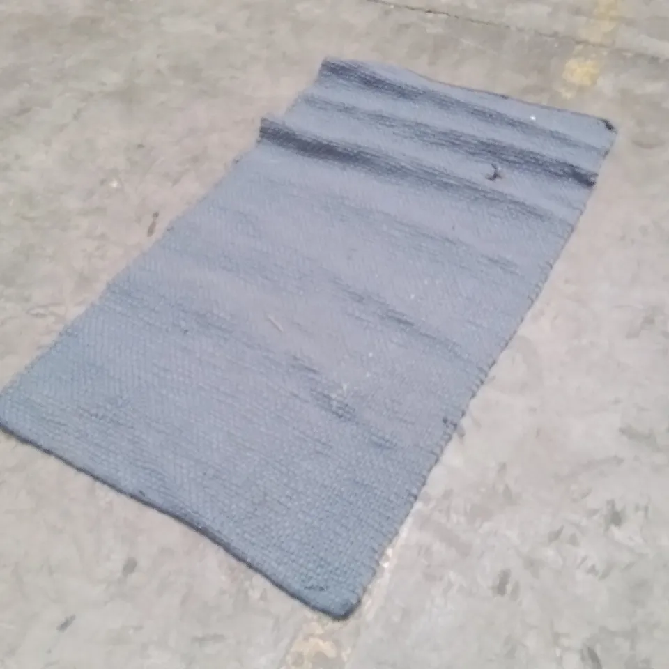 STILLAGE OF APPROXIMATELY 20 QUALITY DESIGNER RUGS