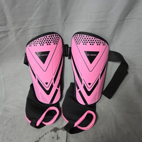 PINK SHIN GUARDS WITH BLACK ELASTIC STRAPS