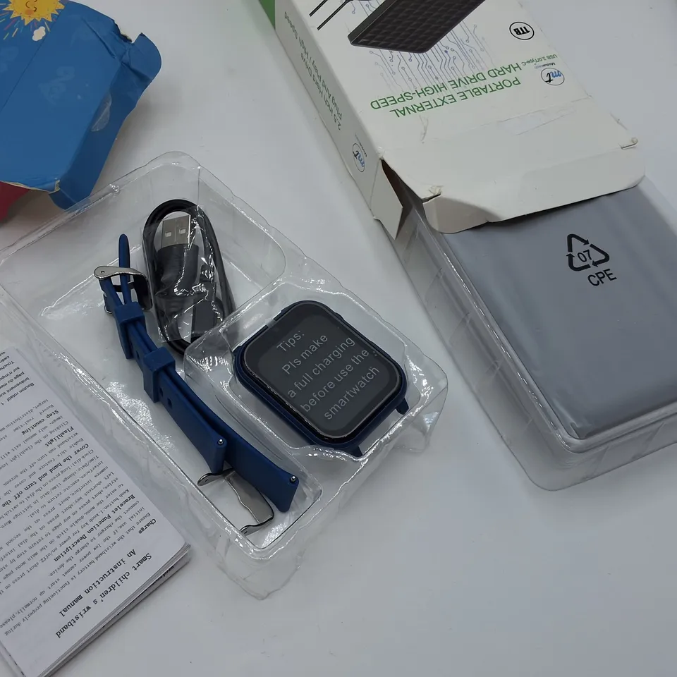 LOT OF 6 ASSORTED TECH ITEMS TO INCLUDE 1TB PORTABLE HARD DRIVE AND CELLY AND DECATHLON SMART WATCHES