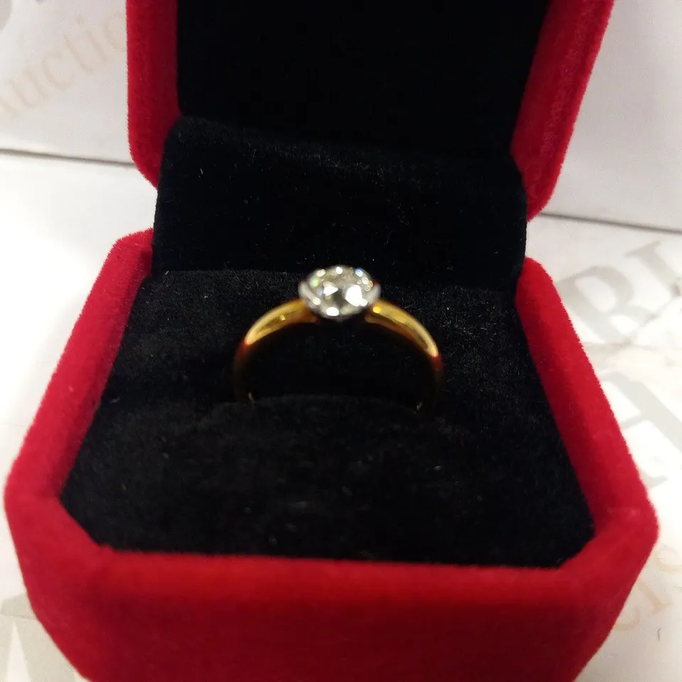 18CT GOLD SOLITAIRE RING SEMI RUB OVER SET WITH A DIAMOND WEIGHING +0.73CT