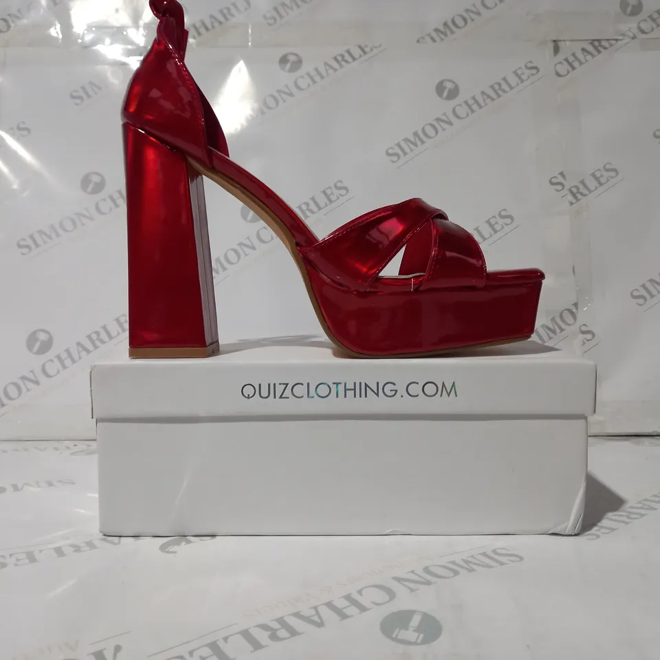 BOXED PAIR OF QUIZ OPEN TOE HIGH BLOCK HEEL SANDALS IN RED SIZE 8