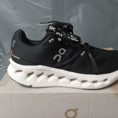 BOXED PAIR OF ON CLOUDSURFER TRAINERS IN BLACK/WHITE - UK 6